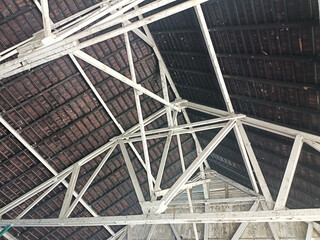 The roof structure of this historic building still uses wood and shingles