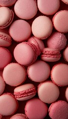 Fototapeta premium Assorted macarons in pastel and chocolate tones, artfully arranged for a delicious and aesthetic background
