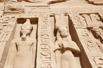 Colossal standing statues of Ramses and Nefertari at entrance of the Temple of Nefertari, Egypt