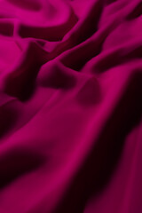 Vibrant Magenta Fabric with Soft Folds – Elegant Abstract Textile Background