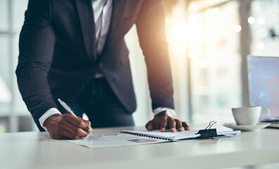 Businessman, writing and documents with policy at office for corporate contract or agreement on...