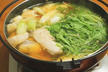 One-pot dish of yellowtail, leeks, potherb mustard, and chili peppers, Japanese gourmet