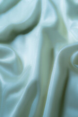 Elegant Light Blue Satin Fabric with Soft Folds – Abstract Texture