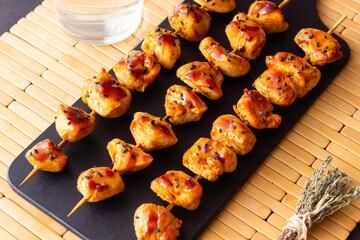 Chicken skewers in teriyaki sauce. Asian food.