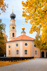 Autumnal church with golden leaves and rows of benches