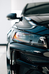 headlight of a black car © Hanna