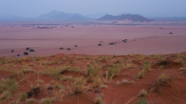 View of Sesriem at sunset from the top of the Elim dune in Namibia in Africa. 