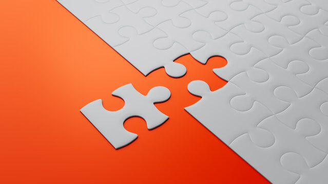 Striking Orange and Grey Jigsaw Puzzle Challenge with a Lone Piece Awaiting Connection