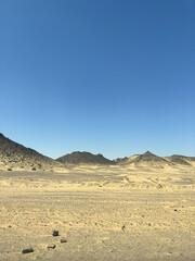Desert scenery on the road trip back from Great Temple of Abu Simbel to Aswan, Egypt