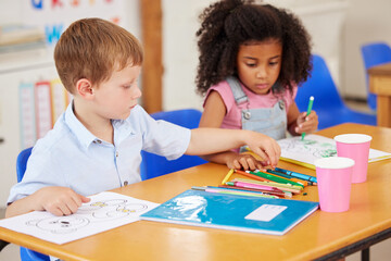 School, children or coloring with sharing in classroom for drawing precision, learning development or art lesson. Kindergarten, students or crayon for education assessment, study or fine motor skills