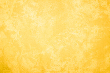 Yellow concrete stone texture for background in summer wallpaper. Cement and sand wall of tone vintage minimal. Concrete abstract wall of yellow color, cement texture white blank for home decor.