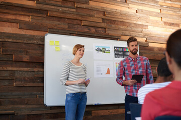 People, designer and whiteboard presentation in office for brainstorming, creative ideas and skater clothes. Staff, talk and planning for sales growth, skateboarding target and information of project