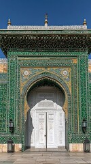A Decorated Building Entrance Featuring Ornate Design and Green Tiles