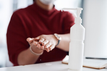 Woman, hands and bottle in office with sanitizer, disinfectant and covid 19 compliance for virus prevention. Business person, liquid and rub in workplace with sterilizer, safety or hygienic practice