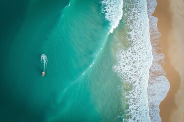 Turquoise ocean waves from above, a serene seascape of calm and beauty.