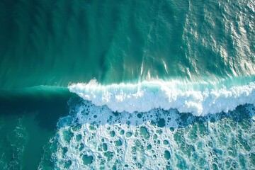Turquoise ocean waves from above, a serene seascape of calm and beauty.
