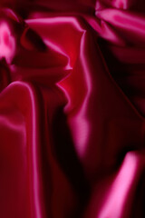 Luxurious silky fabric in deep magenta with elegant folds and soft lighting. Perfect for fashion design, textile backgrounds, branding, digital art, beauty aesthetics, romantic themes