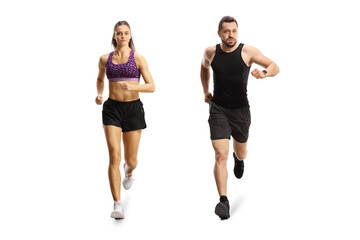 Young fit man and woman running towards camera