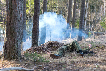 Soldiers in the forest. Military men in camouflage with weapons.