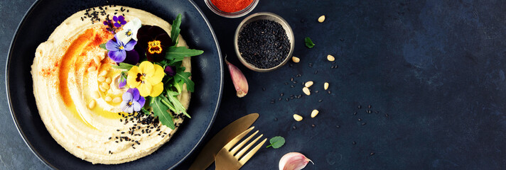 Gourmet Hummus with Edible Flowers, Pine Nuts, and Olive Oil,  Banner Image