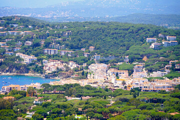 view from the viewpoint at the lighthouse Far de Sant Sebastia over the landscape at the Costa Brava with the white village Calella de Palafrugell during sunset, Catalonia, Spain