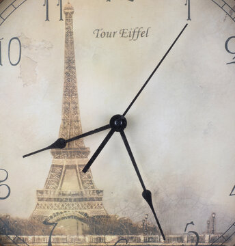 vintage wall clock with Eiffel Tower isolated on white background