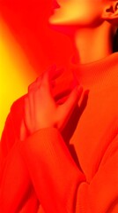Obraz premium Warm hues embrace an artistic pose of a figure in orange attire