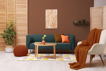 Stylish living room with elements in mocha mousse shade. Interior design with trendy color of 2025...