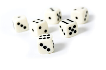 six dice on white surface, tilted view