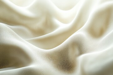 Soft white fabric draped elegantly on a surface showcasing delicate texture and light play during daylight