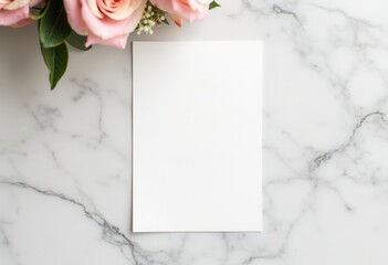 Blank paper mockup on marble surface with pink roses