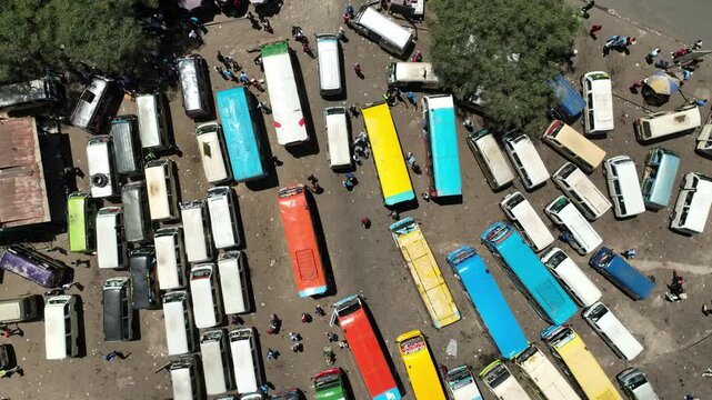 Aerial view of a bustling matatu terminus with colorful buses and busy people, Nairobi, Nairobi, Kenya.