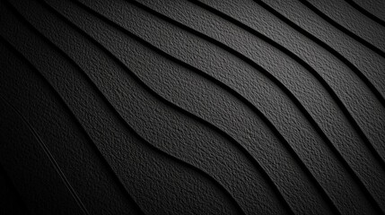 Fototapeta premium A close-up image showcasing textured, wavy black surfaces, possibly representing rubber or material with intricate patterns.