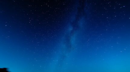 blue night sky milky way and star on dark background with noise and grain, Created with generative AI.