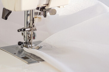 Sewing Machine Close-Up with White Fabric