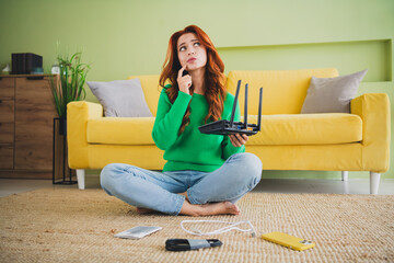 Full body portrait of nice young girl hold router think weekend modern green interior flat indoors