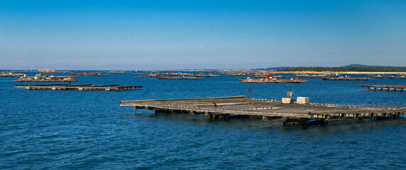 Fototapeta premium Mussel Aquaculture Rafts Batea, Mussel Growing Sea Platform, Batea Mussel Farms, Ría de Arousa, Arousa Estuary, Pontevedra, Galicia, Spain, Europe