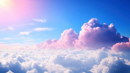 Dreamy pink and white cloudscape at sunrise, viewed from above the clouds.