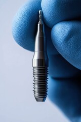 Naklejka premium Dental Implant in Gloved Hand on White Background