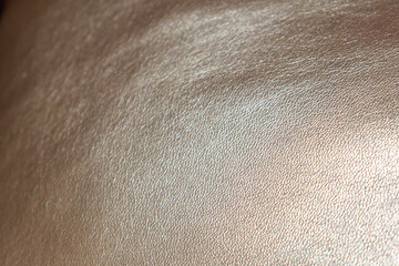 Naklejka premium Golden background of an authentic image of an object, zoom on its texture for background and concept