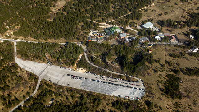 Aerial view of Fonte Cerreto, a small tourist resort located near Gran Sasso, in Abruzzo, Italy. There is a large parking lot for cars.