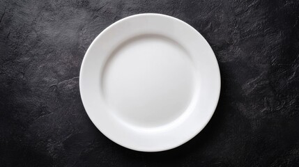 Pristine White Plate on Dark Surface with No Food Presentation