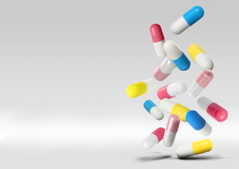 Many different pills falling on light grey background, space for text