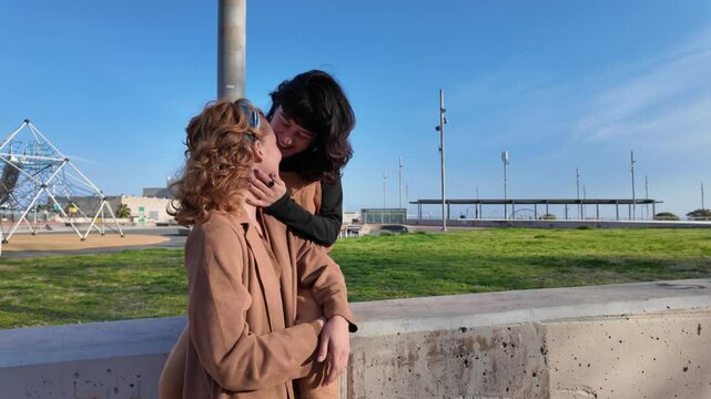 Lgbt couple kissing in a park
