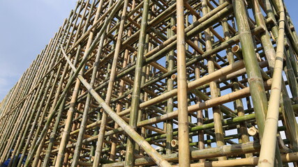 Bamboo scaffolding structure. Detail of bamboo scaffolding at an outdoor construction site in bottom view with copy space. Select focus