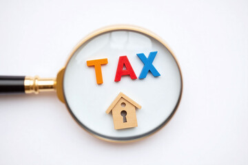 magnifying glass with the word tax under it