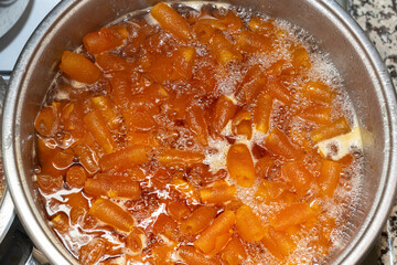 Citrus jam cooked in a saucepan. Jam boiling on the fire