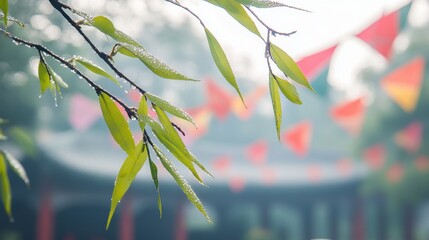 Dew-covered willow branch with green leaves, traditional Qingming kites in background, symbolizing renewal and tradition.