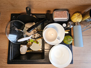 Dirty Dishes in Sink, Kitchen Mess, wooden kitchen, dirt, view of the sink. High quality photo
