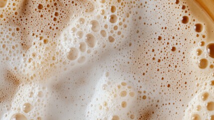 A close-up image of a well-crafted espresso with foam on top, showcasing the latte art and creamy texture.